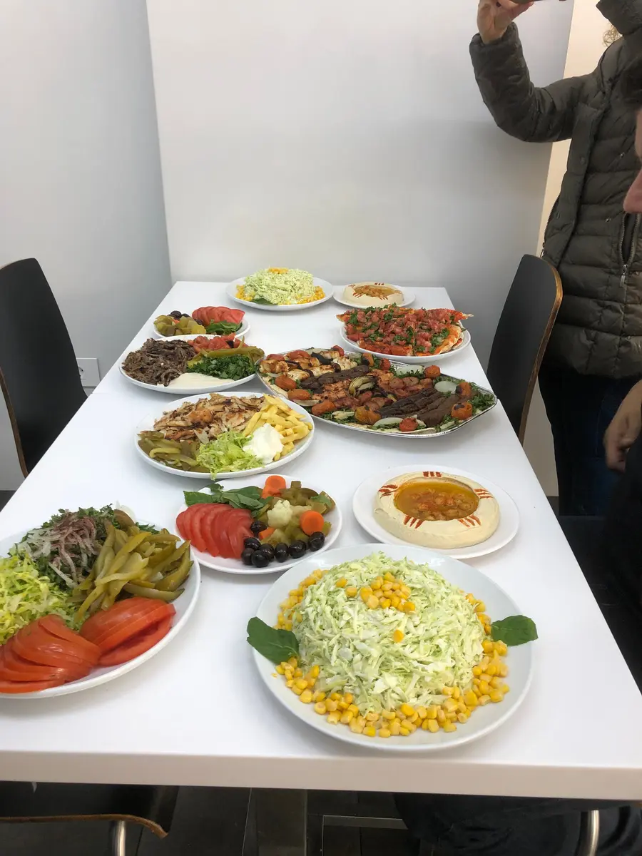 11 Best Lebanon Restaurants: A Food Critic's Guide 4 A close-up of the famous chicken shawarma from Restaurant Joseph, packed with chicken, garlic sauce, and pickles.