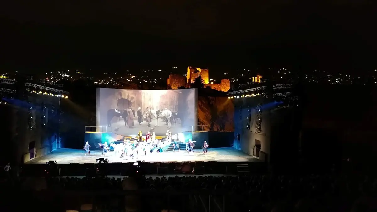 Byblos International Festival stage built over the Mediterranean sea with Crusader castle background during Lebanon festivals.
