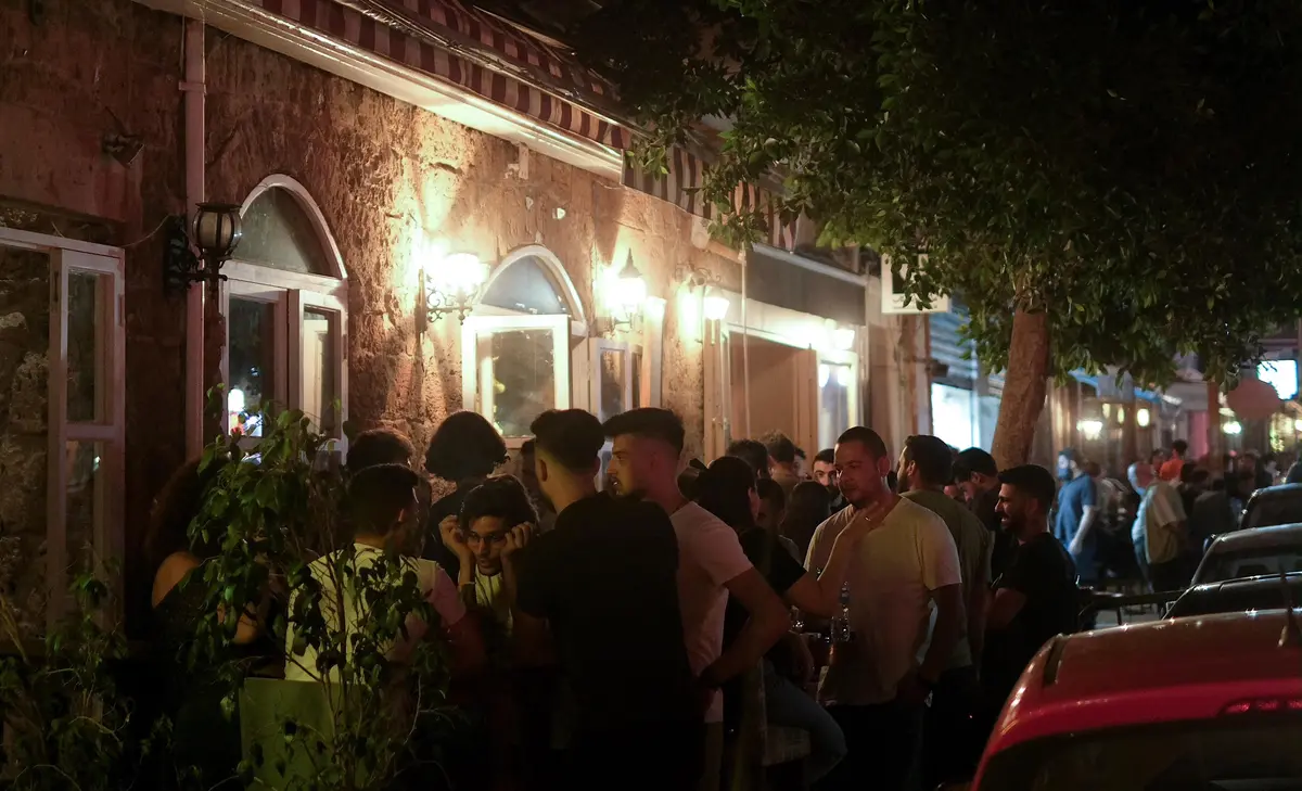 Lebanon Nightlife: The Ultimate Insider's Guide 1 A crowded street in Mar Mikhael, Beirut, alive with people enjoying the vibrant Lebanon nightlife.